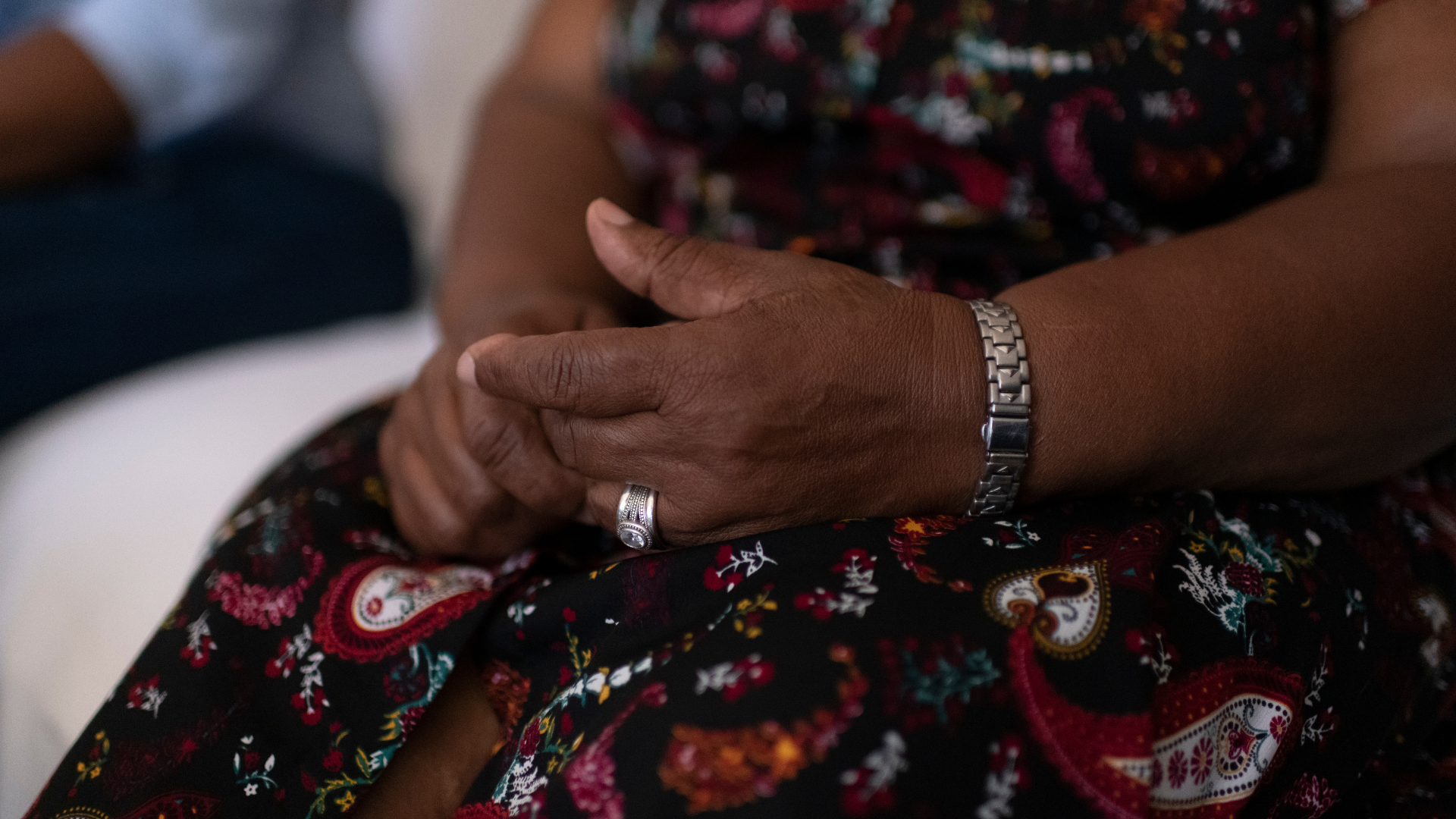 A woman's hands in her lap