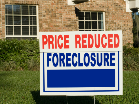 Foreclosure sign in front of a house